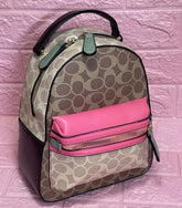 Bolso de dama Mini Morral Coach color a elección